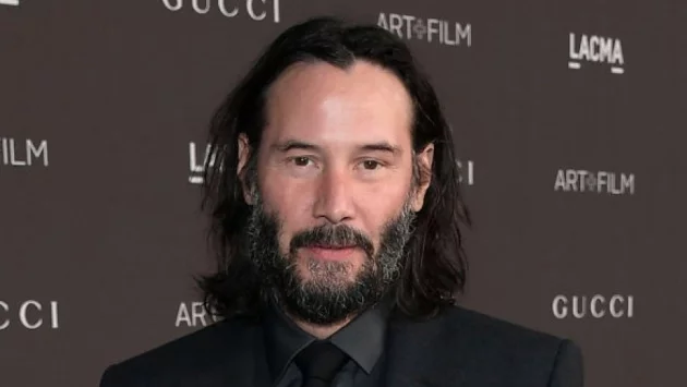 Изненадващо Киану Рийвс се появи с жена  (снимки)